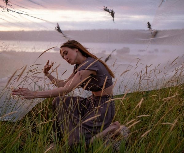 Serene woman meditating in a calm, balanced environment.
